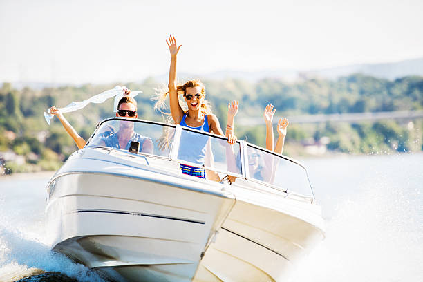 istock Cheerful young people riding in a speedboat. 175380964