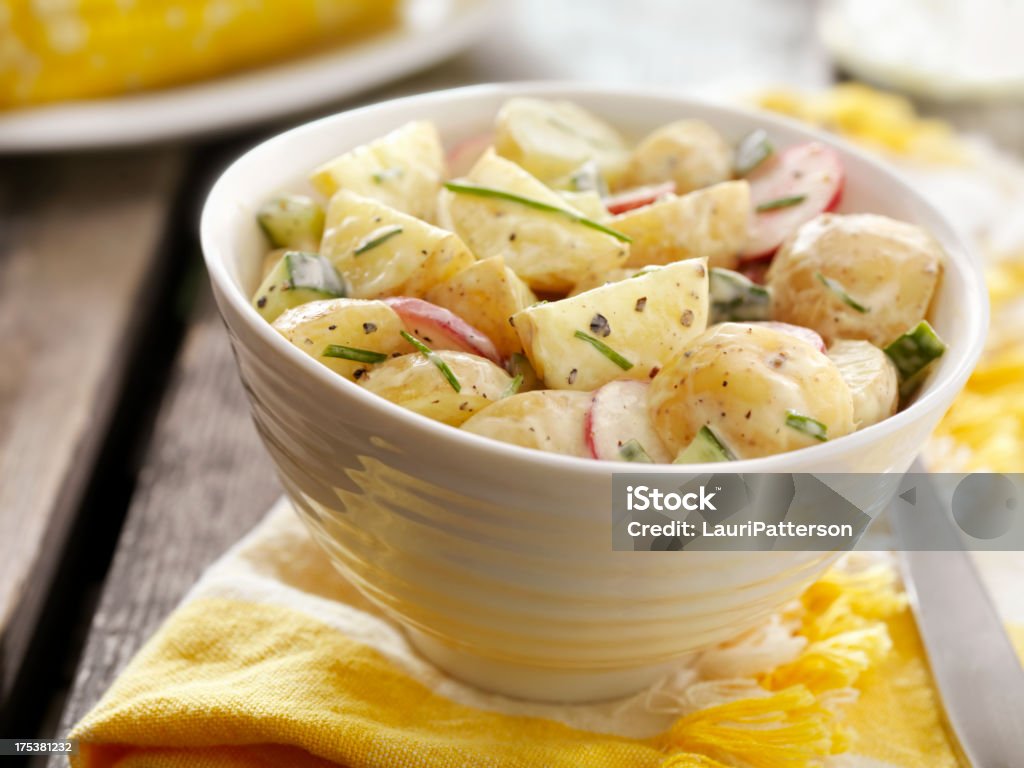Potato Salad at a Picnic Potato Salad with Radishes and Cucumbers and Fresh Chives at a Picnic -Photographed on Hasselblad H3D2-39mb Camera Potato Salad Stock Photo