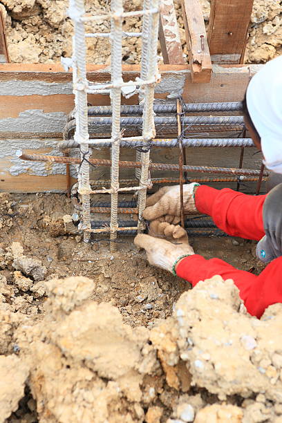 istock worker bending steel for construction job 175381364