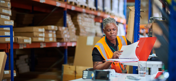 warehouse worker at her despatch desk