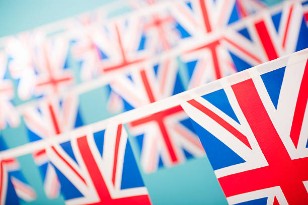 Union Jack bunting Union Jack bunting. Shallow depth of field, focus on the bottom right corner flag.  british flag photos stock pictures, royalty-free photos & images