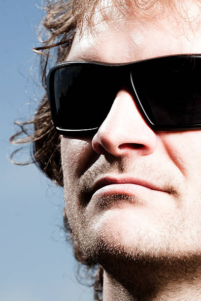 istock CLoseup face of young man with sunglasses 175383825