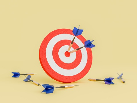 Red target with darts stuck in the center and several on the ground on a yellow isolated background. 3d rendering