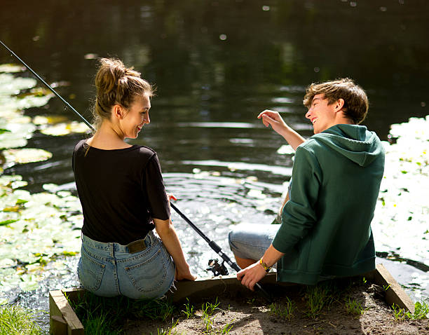 istock young couple fishing and splashing 175384203