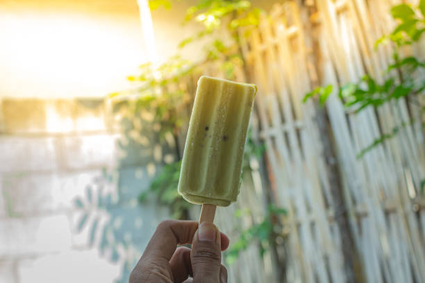istock Green bean ice cream is held to be consumed 1753844440