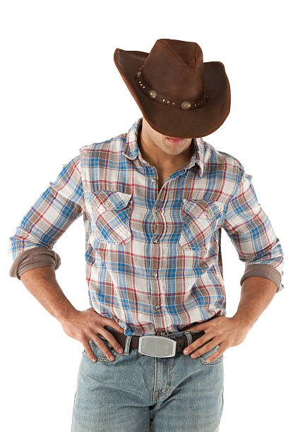 Cowboy standing with arms akimbo