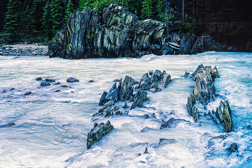 Sharp rocks in a rapid river in the wilderness