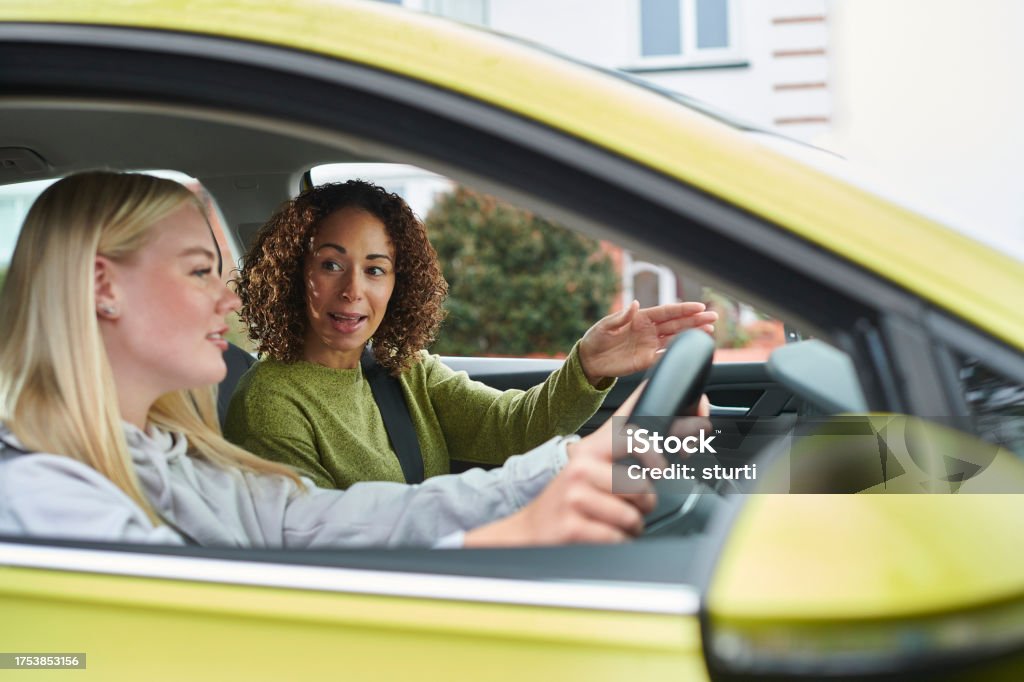 learner driver with instructor 16-17 Years Stock Photo