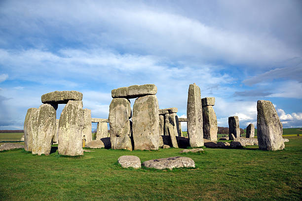 Stonehenge, Salisbury Plain, Wiltshire, England DSLR picture of the prehistoric monument of Stonehenge located in Wiltshire in England. The ring of standing stones is surrounded by green grass with a cloudy sky but sunny day of spring. country geographic area photos stock pictures, royalty-free photos & images