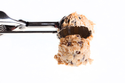 Banana oatmeal chocolate chip cookie dough being scooped.