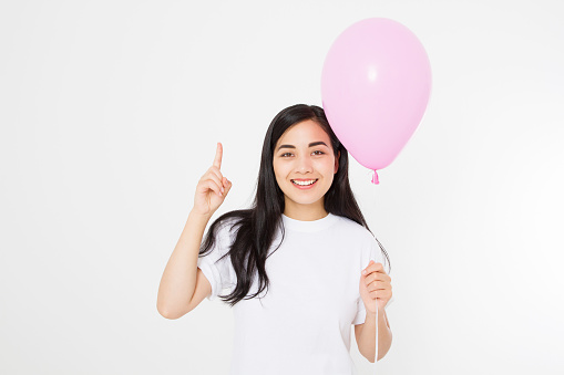 Blank template t shirt. Happy birthday. Happy asian girl with balloon isolated on white background. Copy space. Mock up.