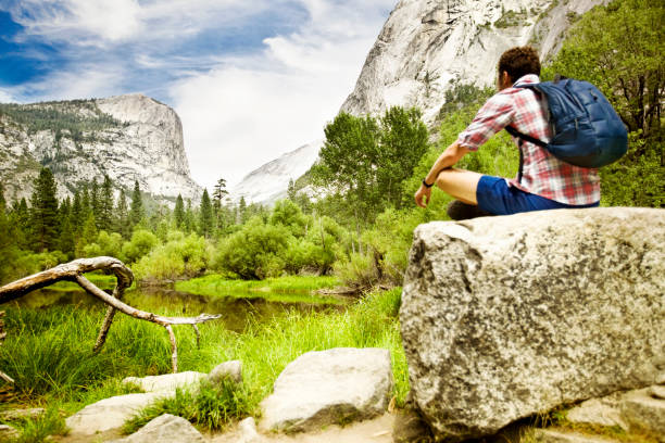 istock Man sitting on rock in Yosemite 175386069