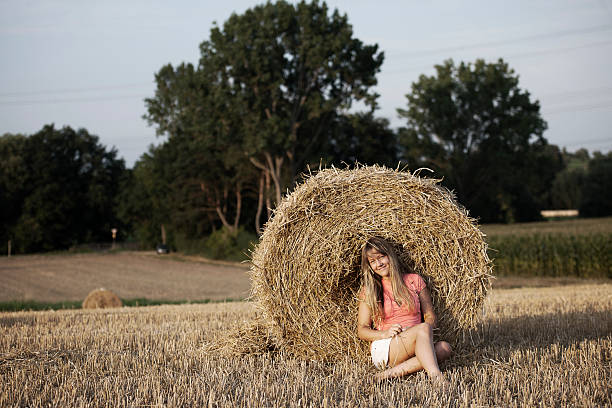istock Young woman relaxing in field 175386337