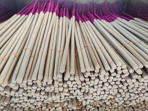 Close-up shot stack of joss incense sticks in a Chinese Buddhist temple