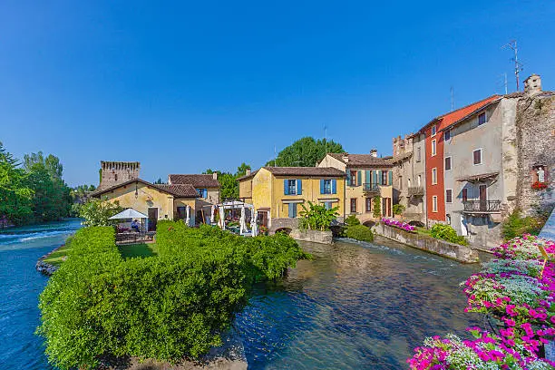 Borghetto is a tiny, charming village on the banks of the river Mincio, built in 1400 around a series of watermills, still visible in the city center. It is situated along the beautiful bike path that connects the Lake Garda in Mantua, in the Regional Natural Park of River Mincio. Valeggio sul Mincio, Verona, Italy. Canon EOS 5D Mark II