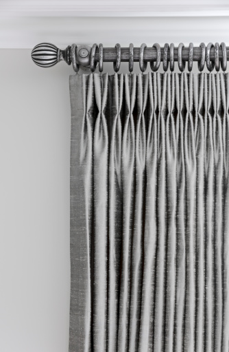 the top section of silver grey coloured silk pleated curtains hanging from matching silver-colour curtain pole. Please see my other Interior and Architectural images by clicking on the Lightbox link below...A>AA>A