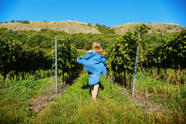 istock A long-haired girl running through a vineyard on a sunny summer day 1753871418