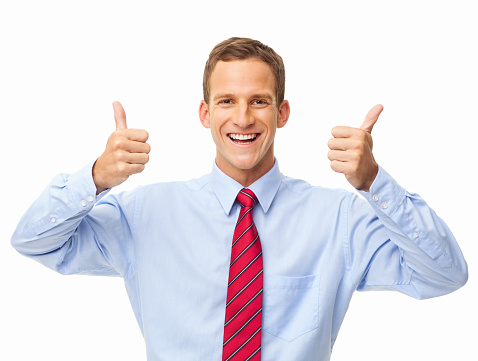 Portrait of a happy young businessman gesturing thumbs up. Horizontal shot. Isolated on white.