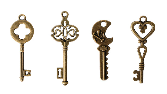 Antique bronze keys, isolated on white or transparent background cutout.