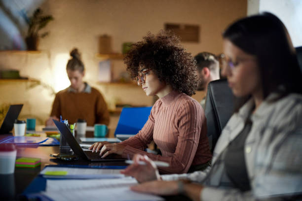 istock Young female programmer working on laptop in the office. 1753875384