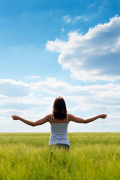 istock Girl in a green field 175387573