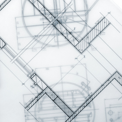 architect drafting tools displayed over detail blueprint