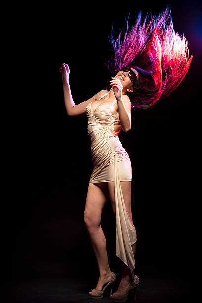 istock Young women dancing on black background 175388080