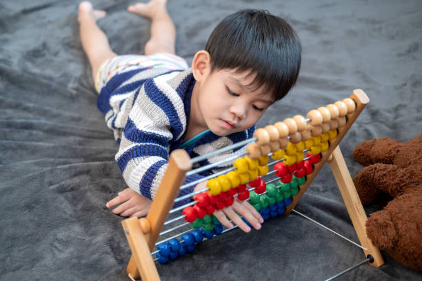 istock Asian boy playing with toys on the bed 1753884332