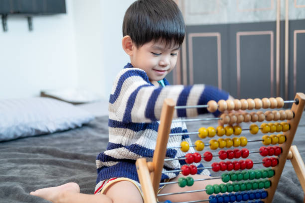 istock Asian boy playing with toys on the bed 1753884343