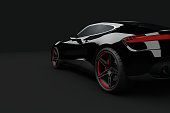 Black sport car on dark background