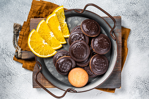 Orange Flavored Round Jaffa Cakes with Chocolate. White background. Top view.