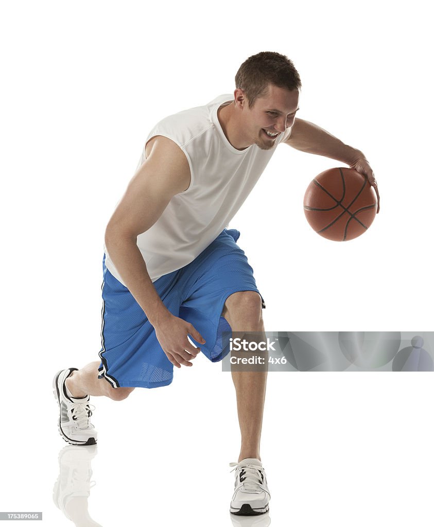 Happy young basketball player in action Basketball Player Stock Photo