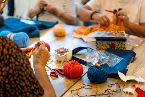 istock Crochet club. Elderly women knitting together in a workshop. 1753890837