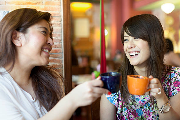 istock Two women drinking coffee at a cafe 175389322