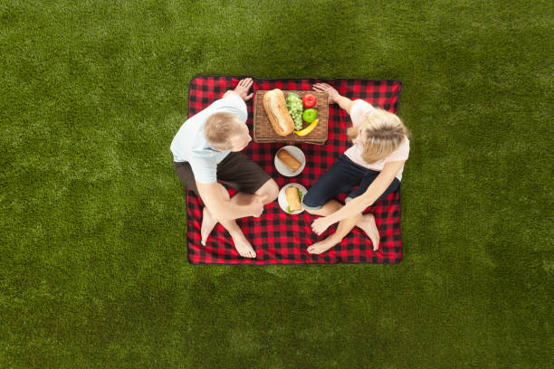 Group of friends enjoying picnic day in a park.