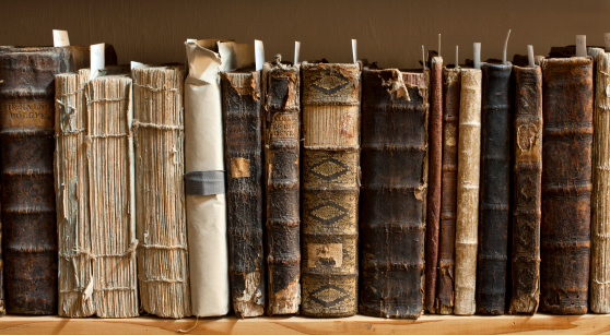 400 year old antique books in a library. Photo was taken at avaible light, for accurate representation of the atmosphere inside.