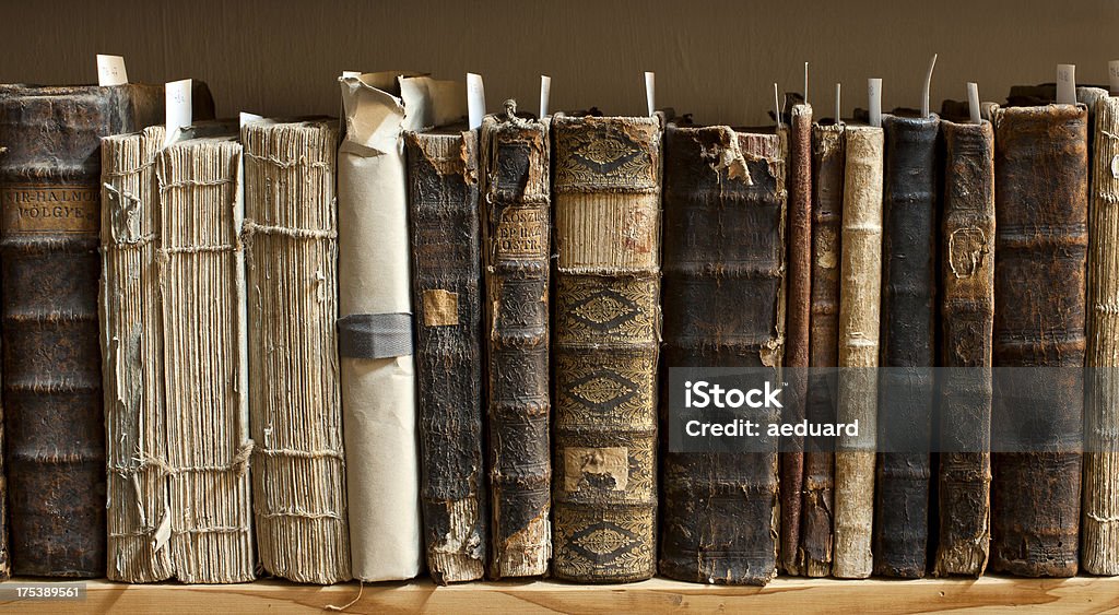 Antique books in a library 400 year old antique books in a library. Photo was taken at avaible light, for accurate representation of the atmosphere inside. Book Stock Photo