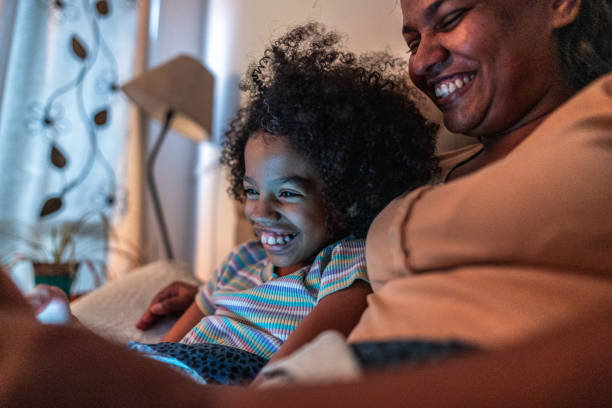 istock Mother and daughter using digital tablet in the bedroom at home 1753896204