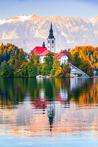Bled, Slovenia. Beautiful sunset at Lake Bled with Julian Alps mountain range in background, travel in Europe.
