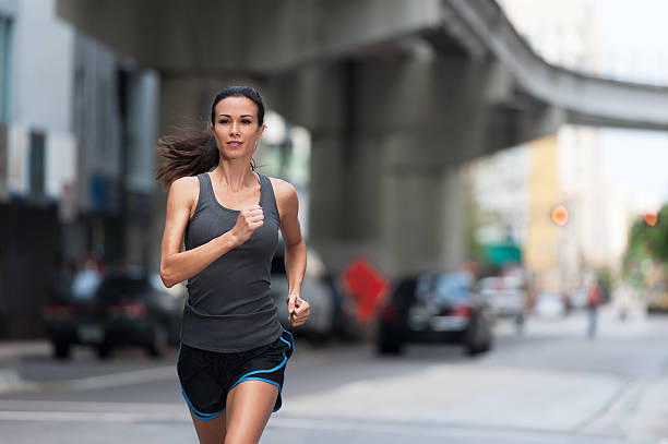 istock Young Woman Running in City Environment 175390199