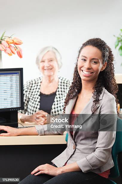 Happy Customer And Friendly Bank Teller At Banking Counter Vt Stock Photo - Download Image Now