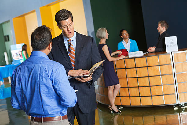 istock Business executive interviewing prospective employee at job fair 175390860