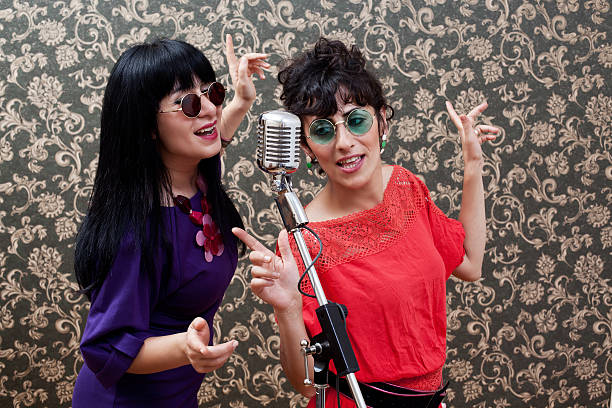 istock Two friends in seventies style singing 175392007