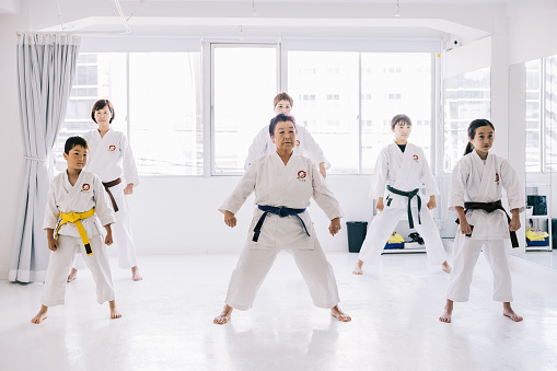 A Japanese Karate class with variety of ages and people, ready to learn the art of Karate together.