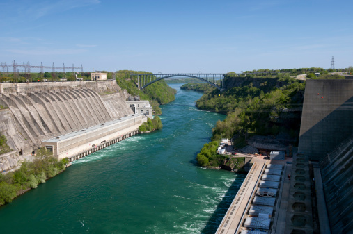 The Robert Moses Niagara Hydroelectric Power Station (right) and the Sir Adam Beck Hydroelectric Power Station (left) sit on either side of the Niagara River generating electricity for the United States and Canada respectively.