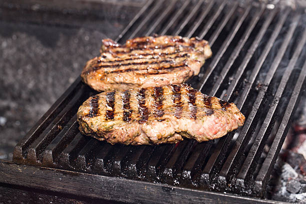 istock cooking a steak on the grill 175392458