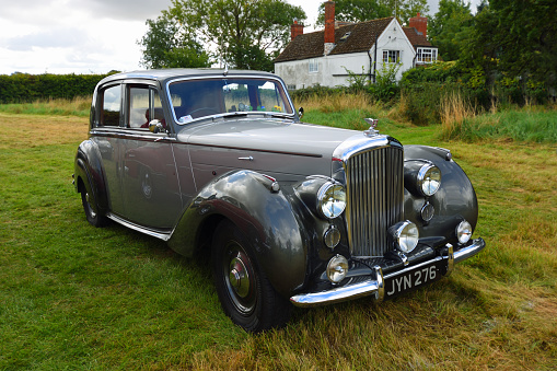 Little Gransden, Cambridgeshire, England - August 27, 2022: Vintage  1948 Bentley MK VI Saloon parked on grass.