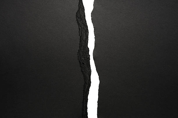 Isolated shot of black torn paper border on white background Black torn paper border isolated on white background. black torn paper edge stock pictures, royalty-free photos & images