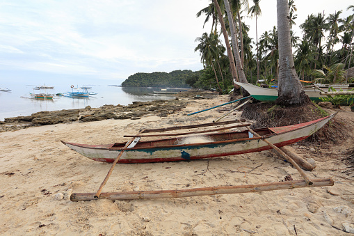 Fishing boats stranded on the beach near El Nido, Palawan Island, Philippines