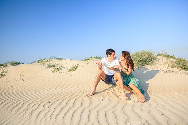 istock Happy young couple at beach 175394105